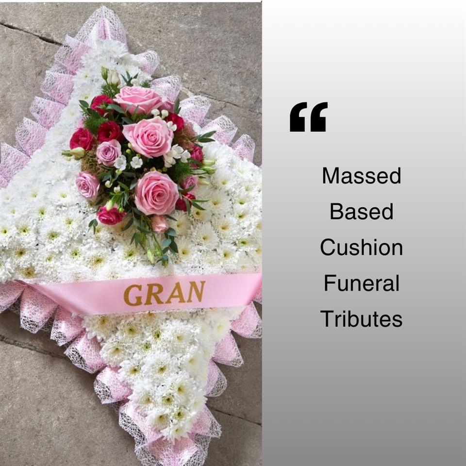 massed - based funeral cushion tribute.